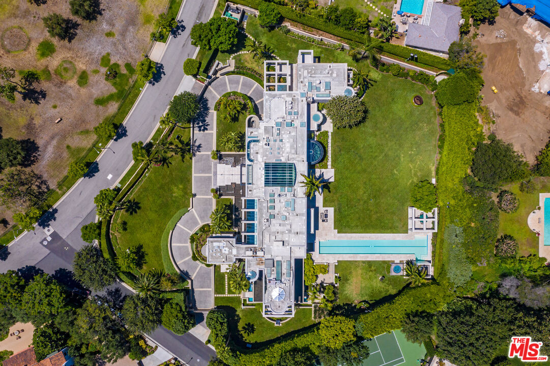 an aerial view of houses with outdoor space