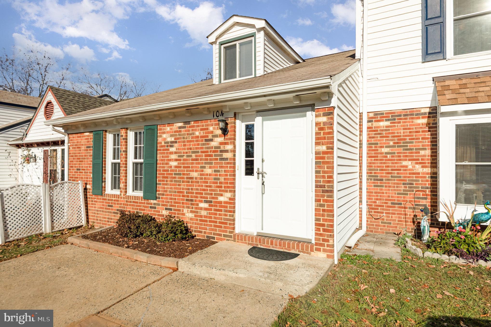 a front view of a house with large windows