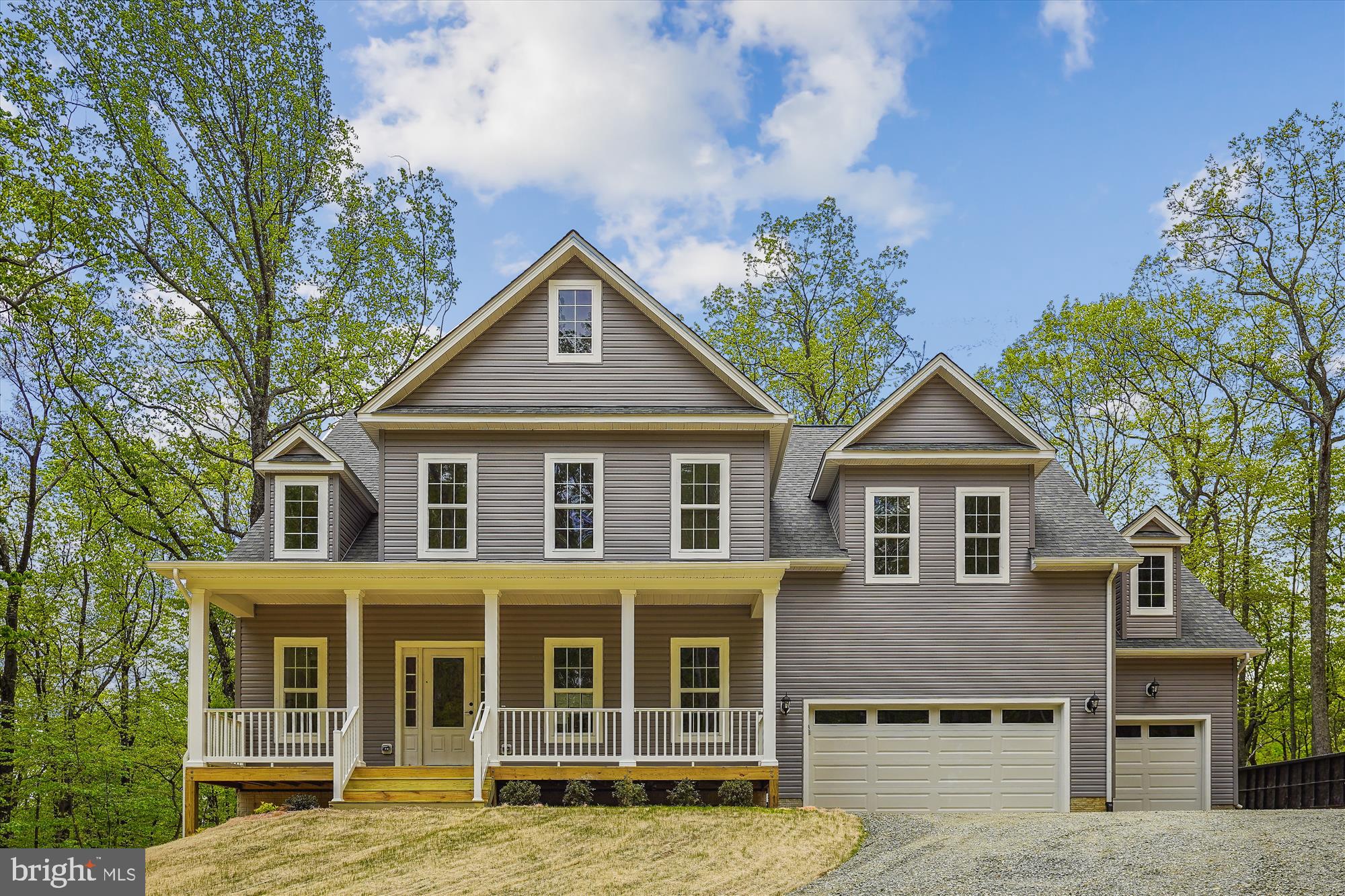 front view of a house with a yard