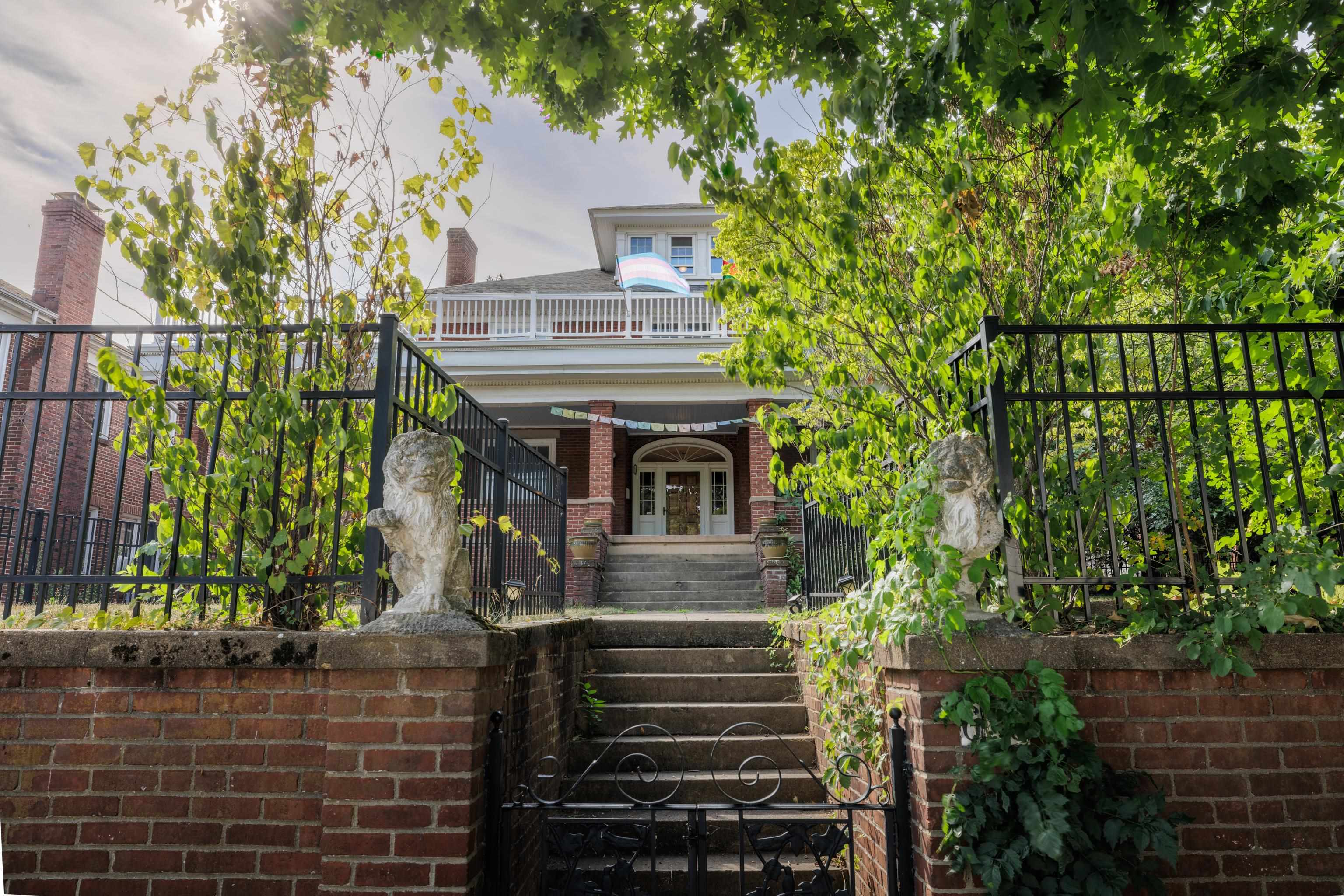 a view of house with a tree in front