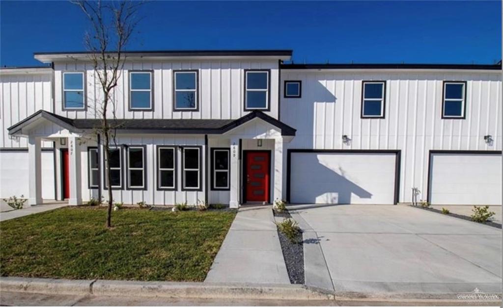 View of front facade featuring a garage