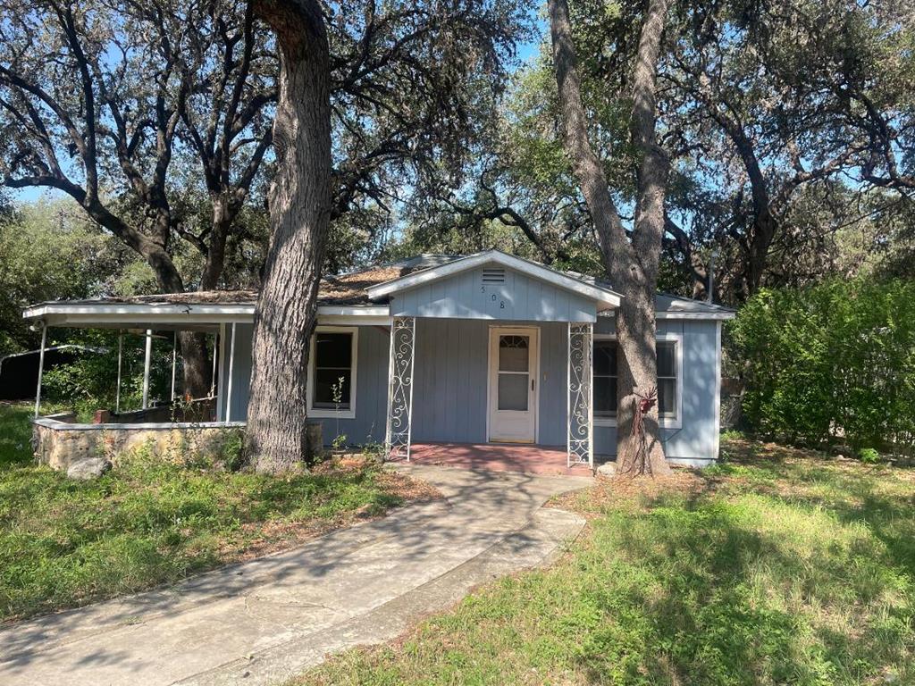 a front view of house with yard outdoor seating and yard