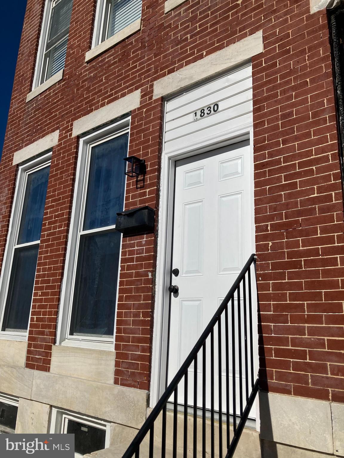 a view of a brick house with a window