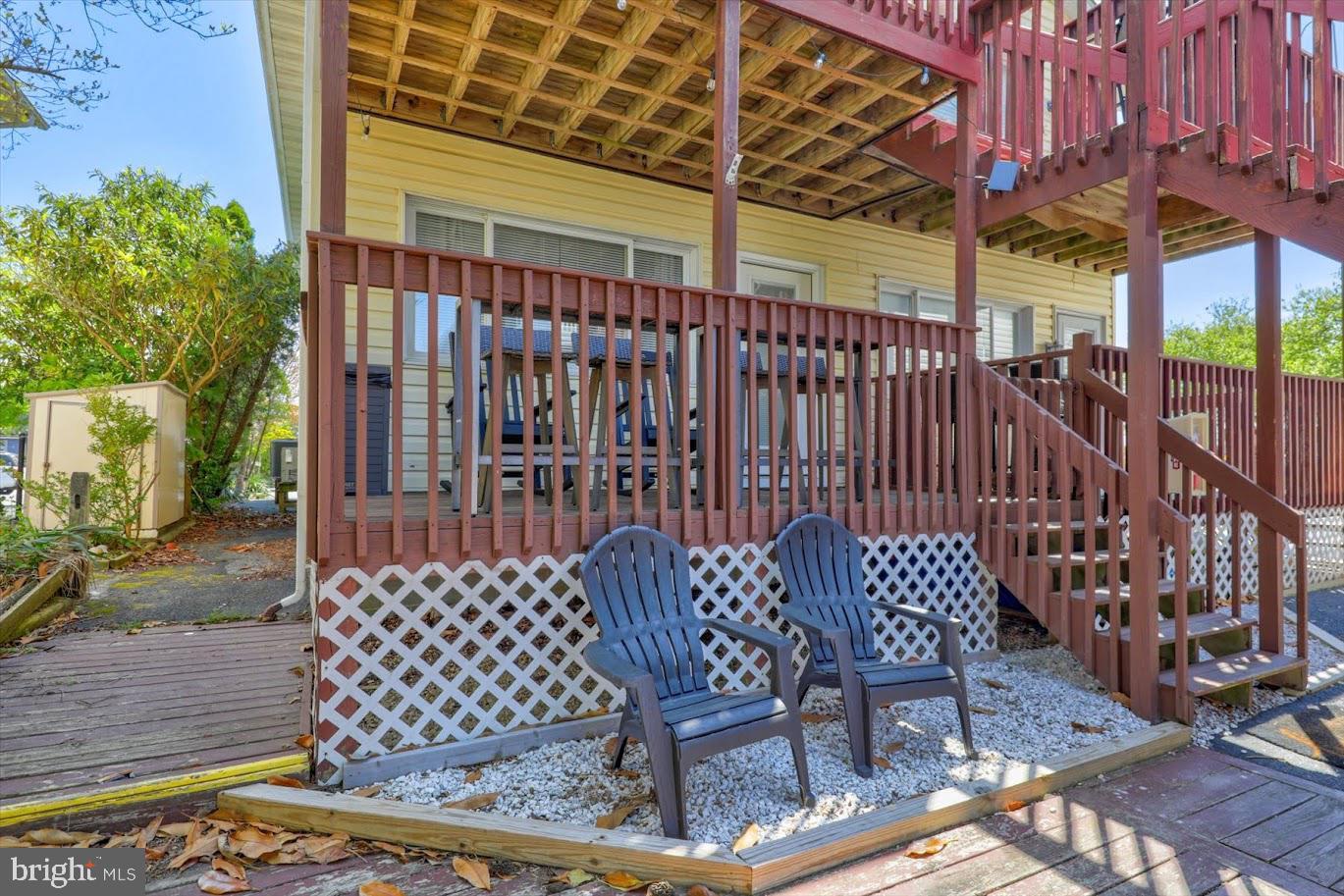 a view of a chairs with wooden fence