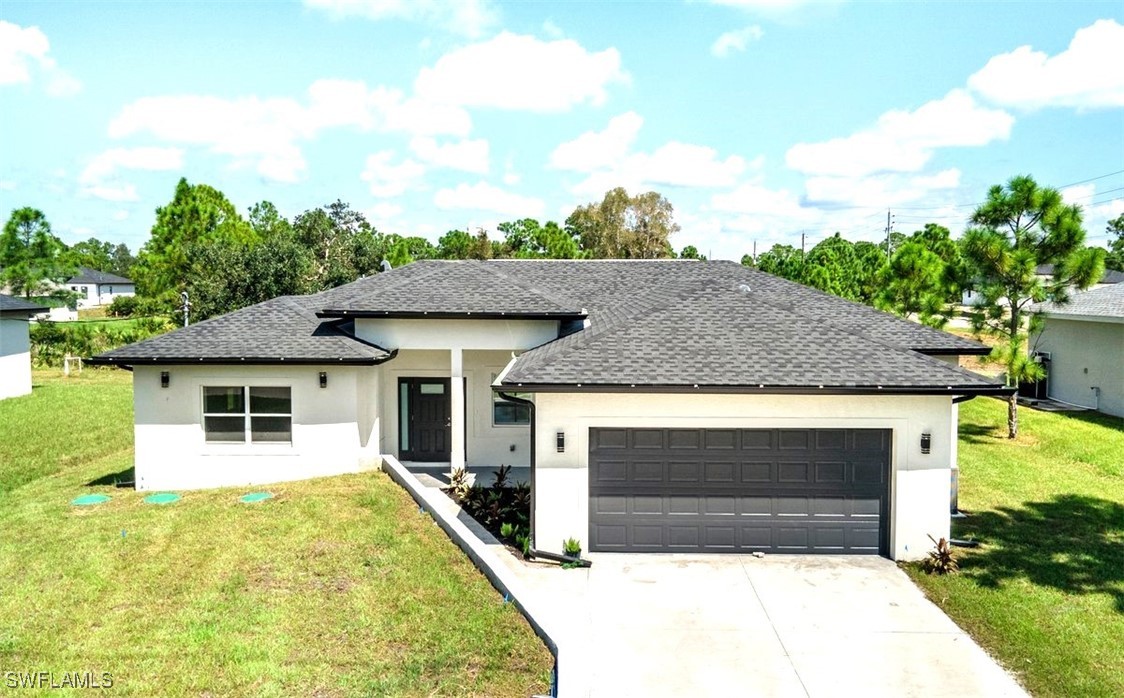 a view of house with yard and entertaining space