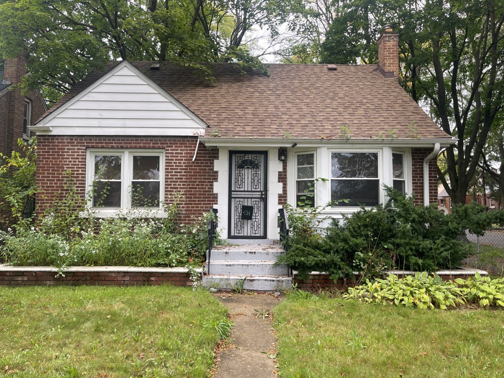 front view of a house with a yard