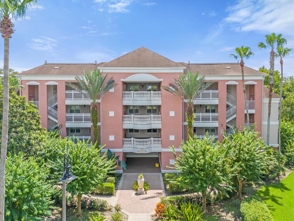 front view of a building with a garden