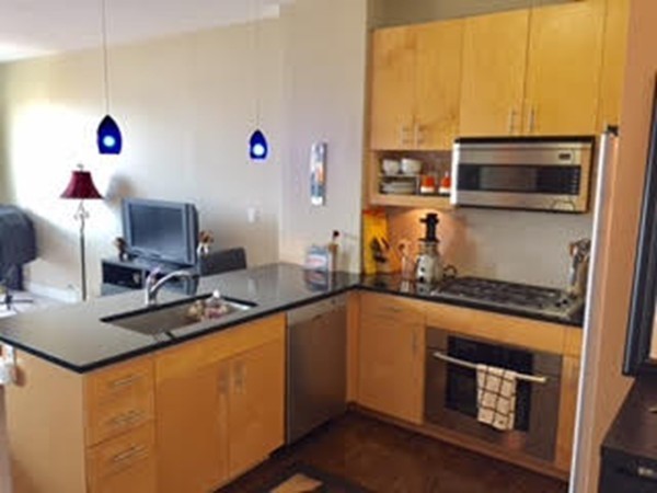 a kitchen with a sink and cabinets