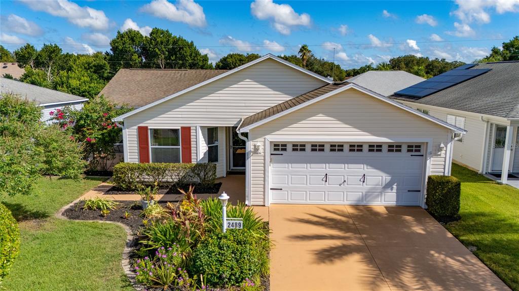 "At Ease" cottage home with 2-car garage facing south.