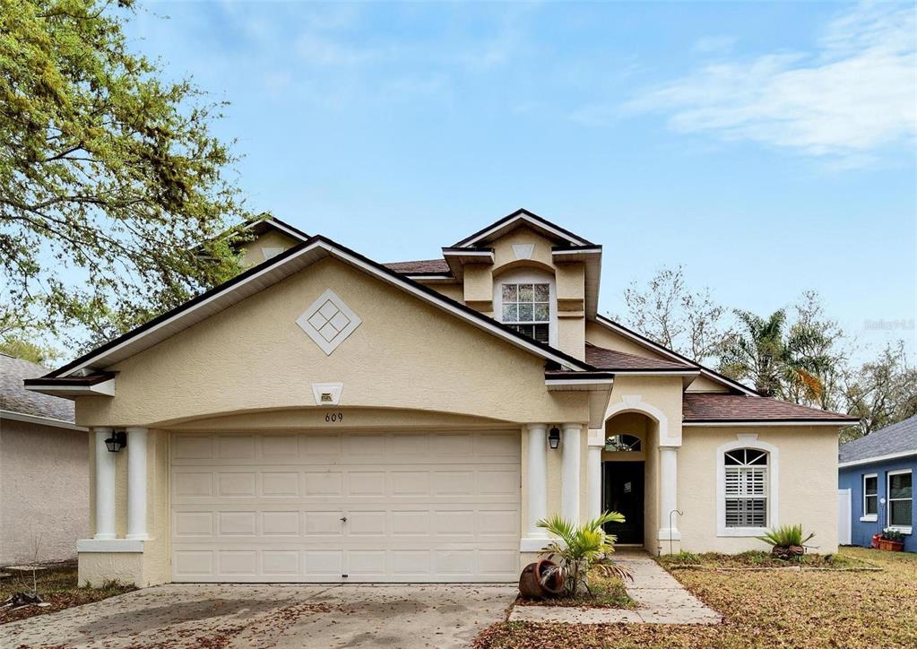 a front view of a house with a yard