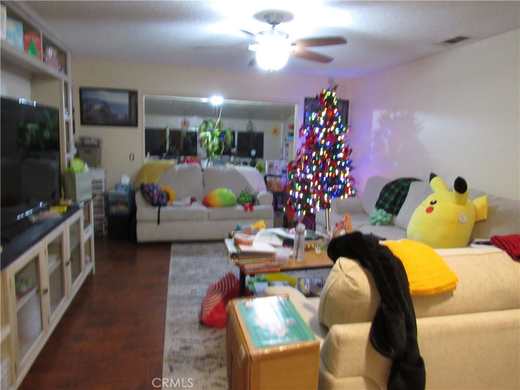 a living room with furniture and flowers