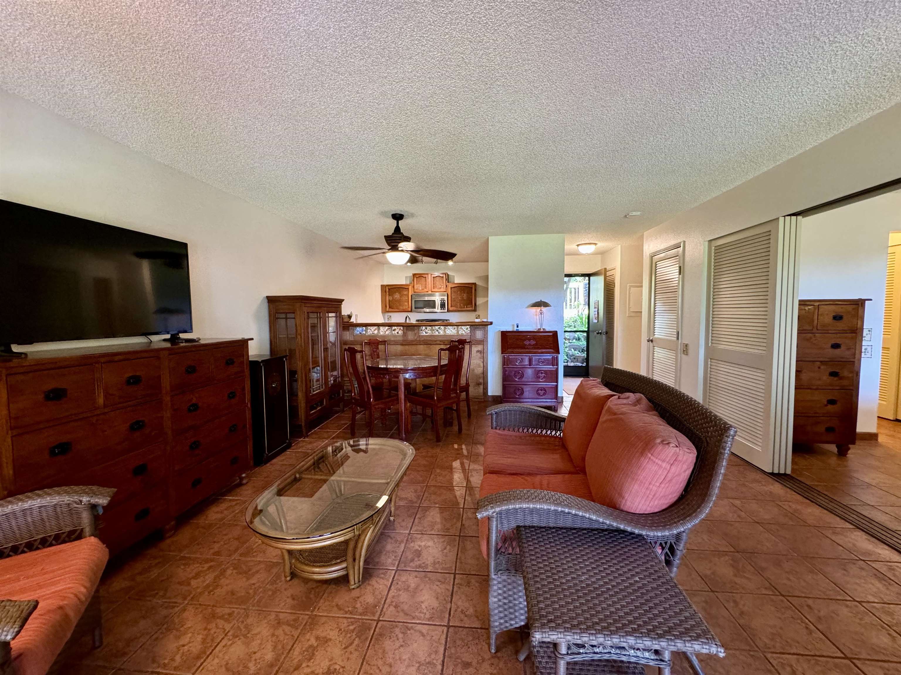 a living room with furniture and a flat screen tv