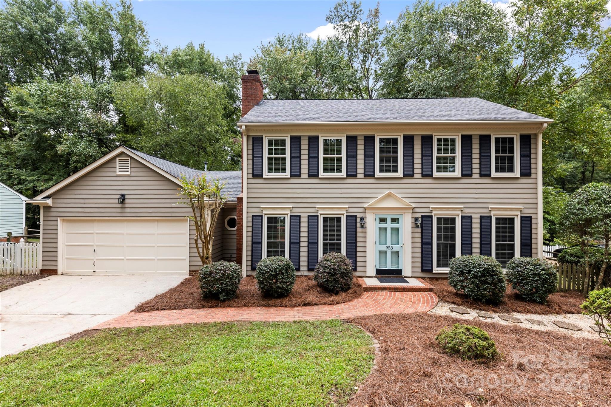 front view of a house with a yard