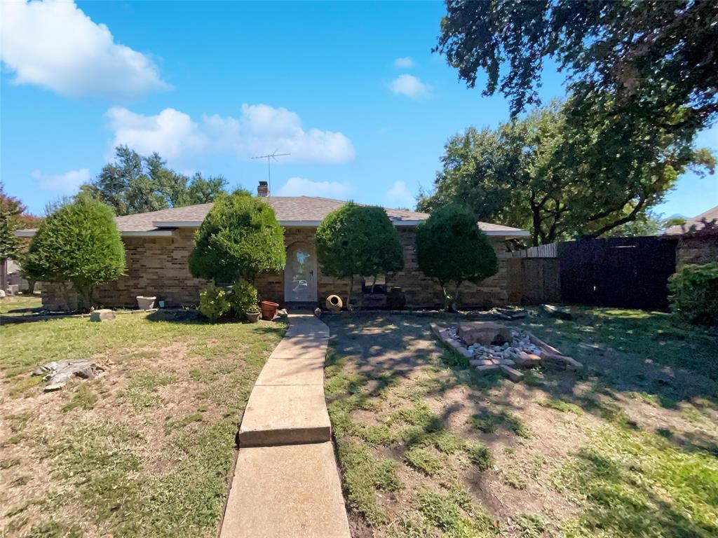 a view of backyard with patio