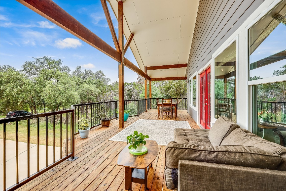 a view of balcony with couch and wooden floor