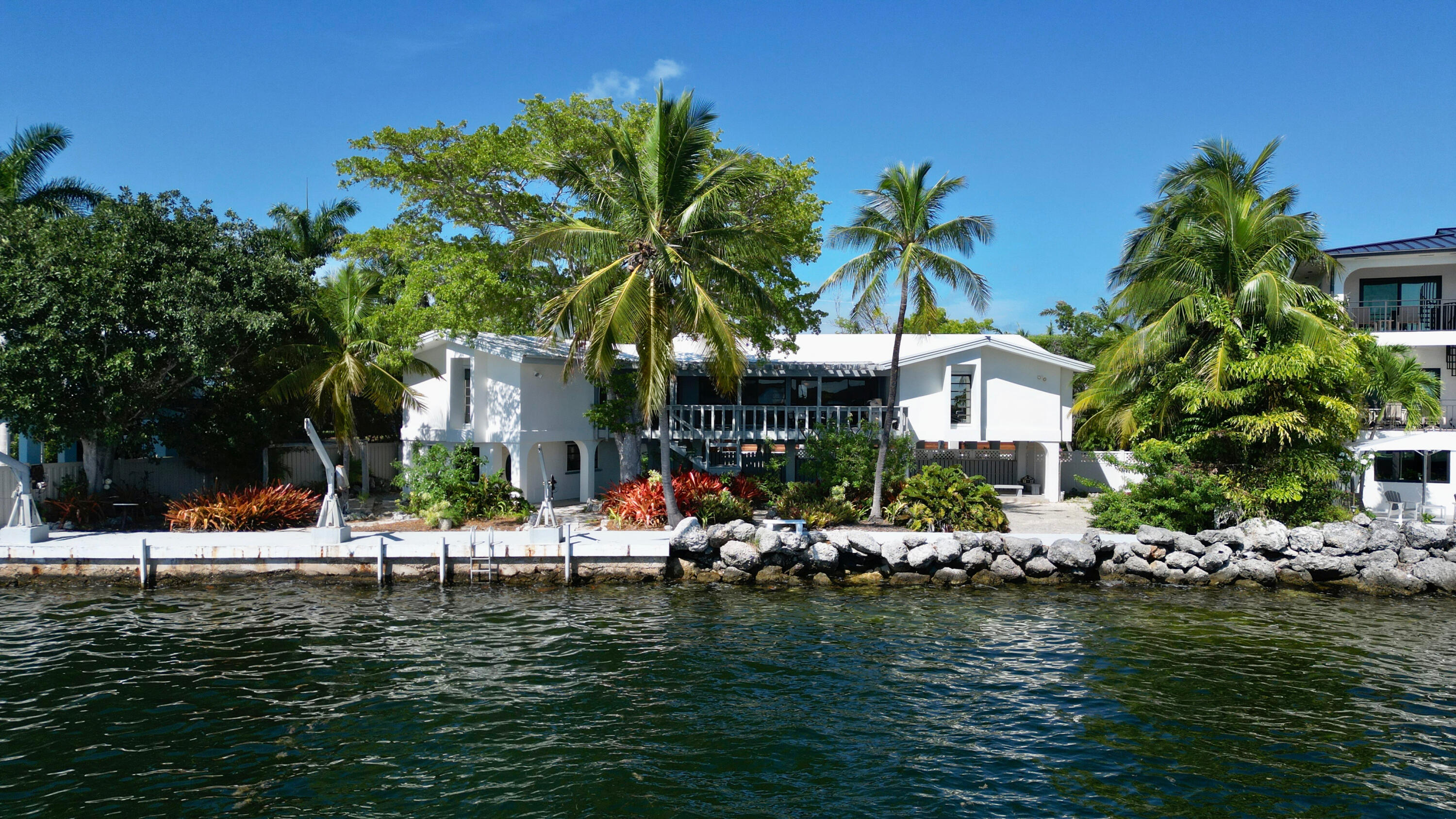 a front view of a house with a lake view