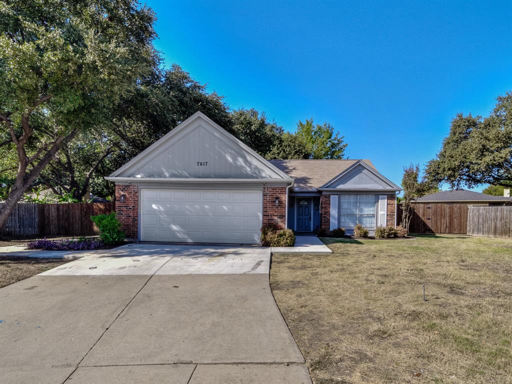 a house with yard in front of it