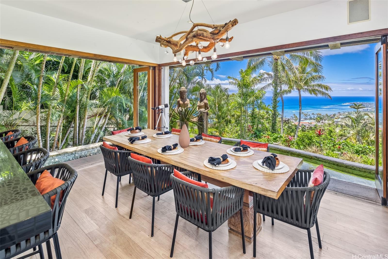 a view of a dining table and chairs in the porch