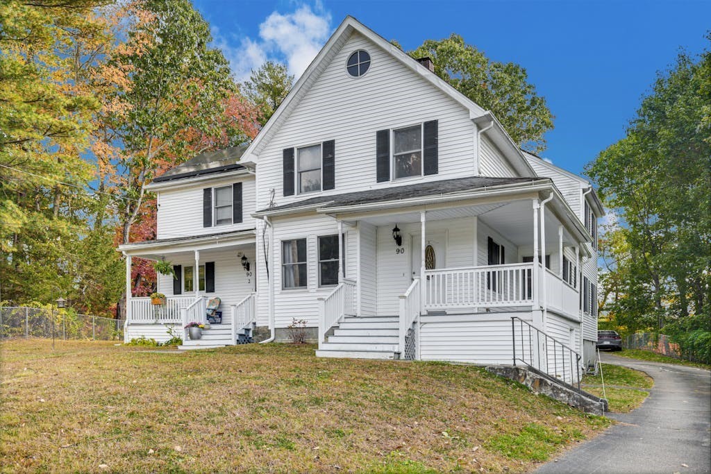 a front view of a house with a yard