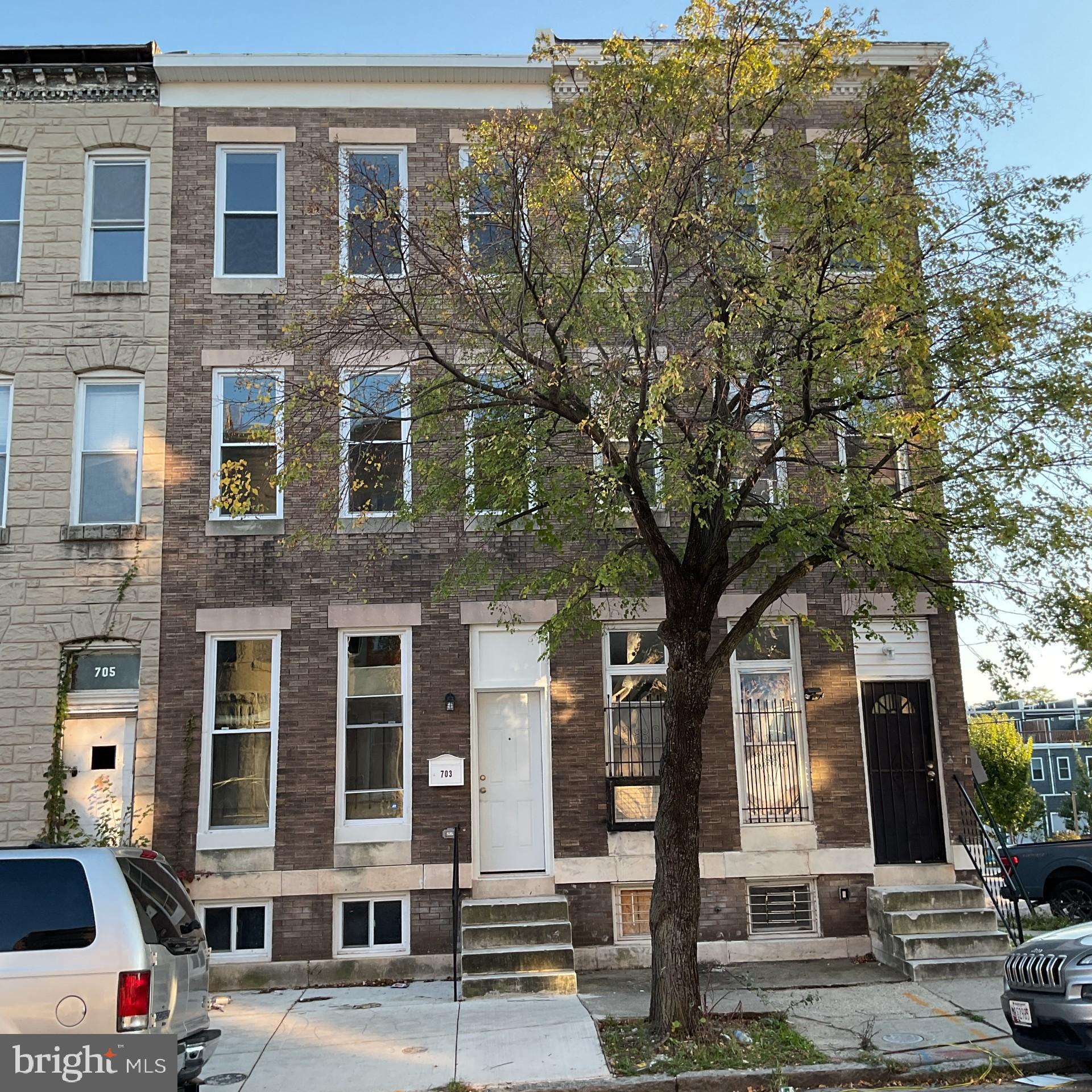 a front view of a building with street view