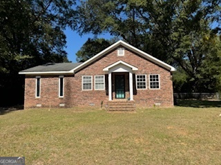 a front view of a house with yard