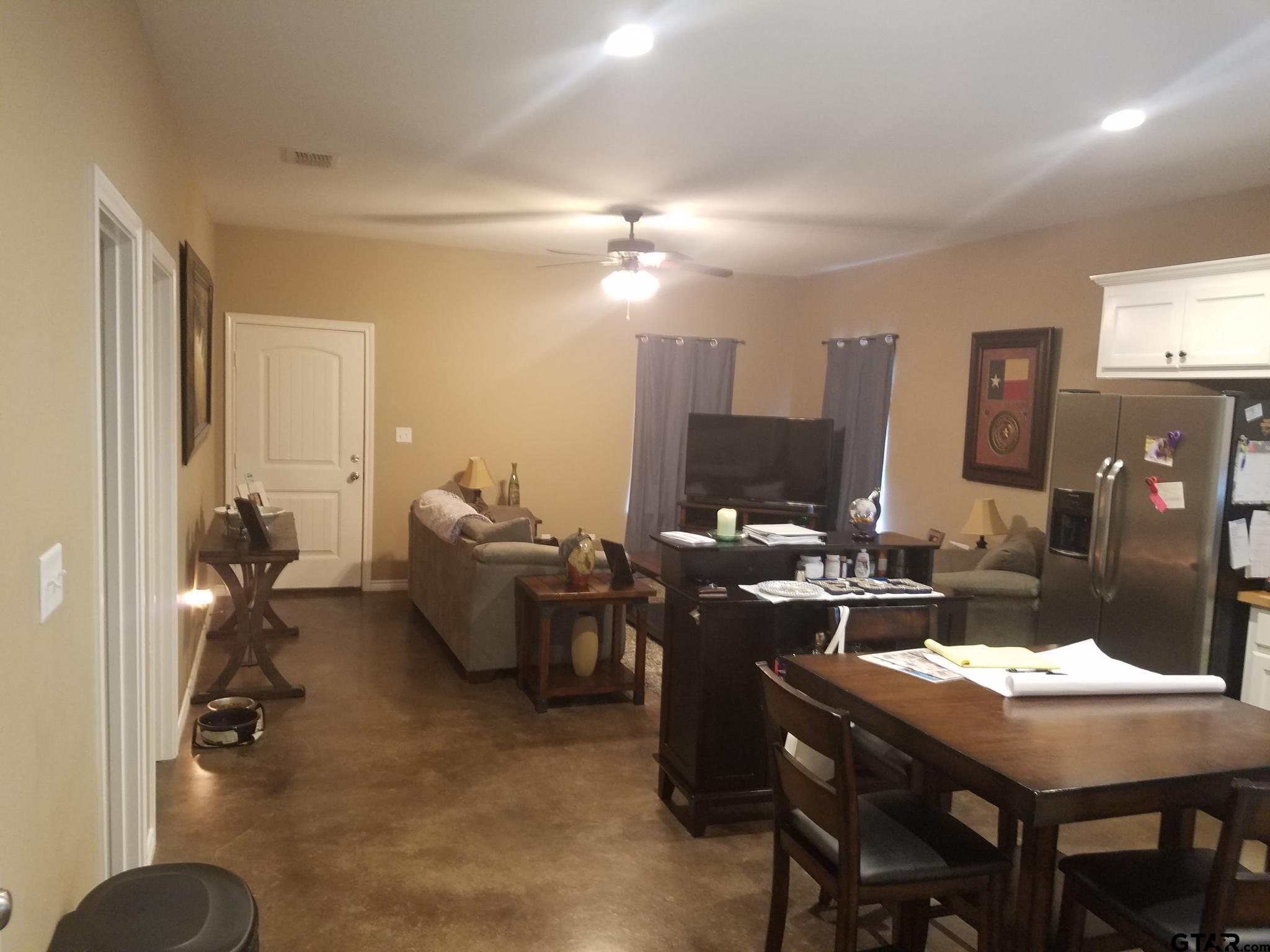 a view of a livingroom with furniture and chandelier