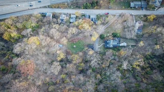 a view of a dry yard with lots of green space