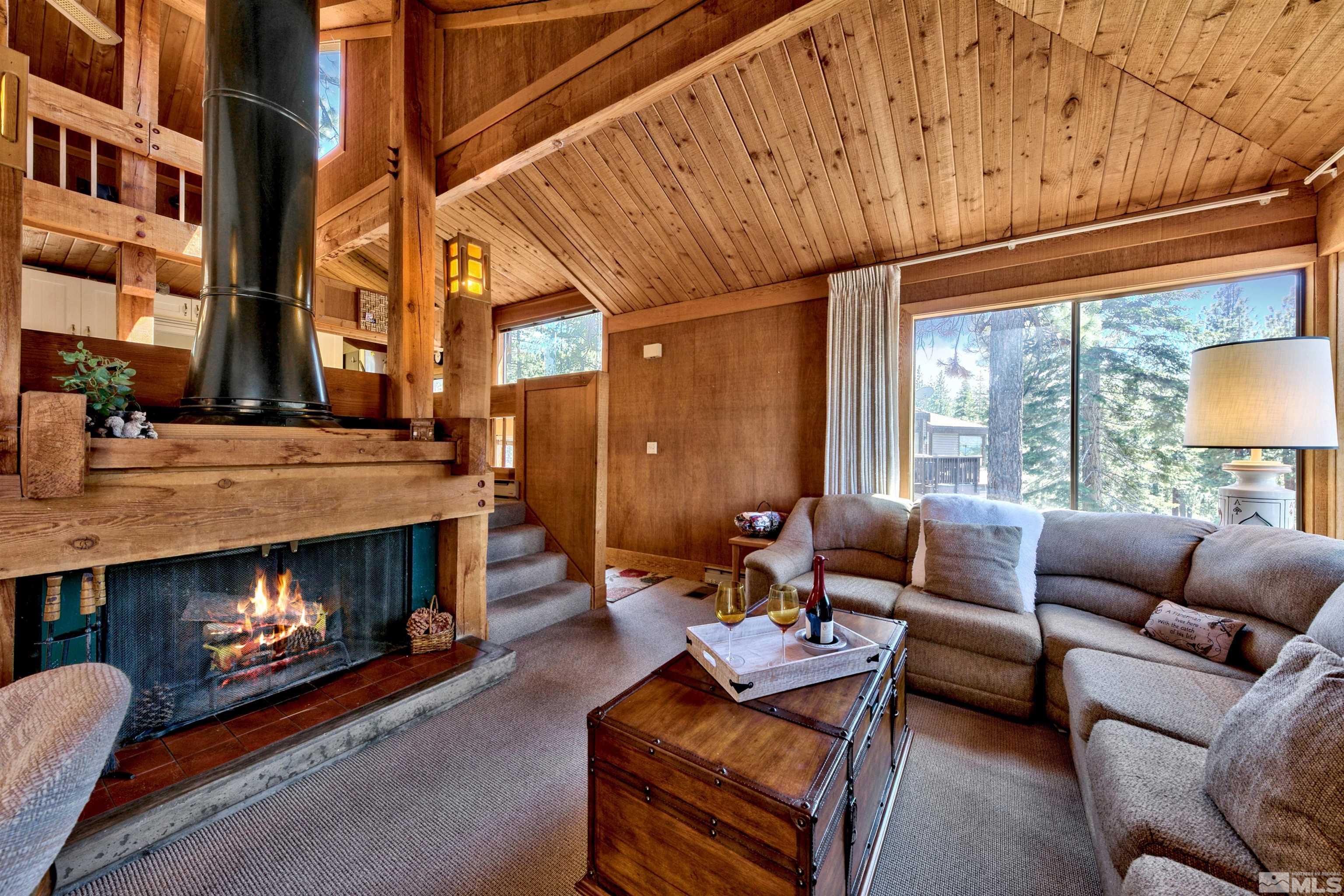 a outdoor living space with patio furniture and a fireplace