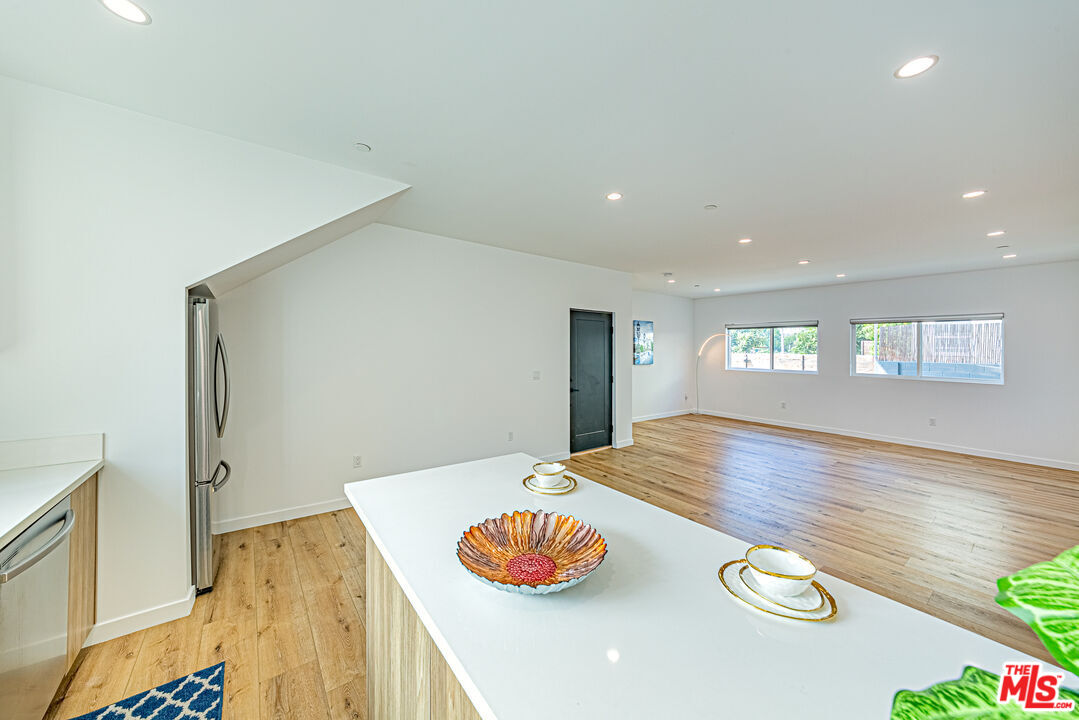 a view of kitchen island with wooden floor