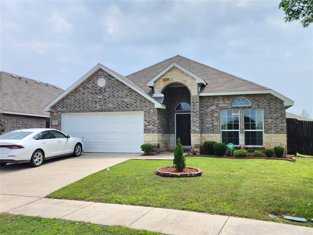 a front view of a house with a yard