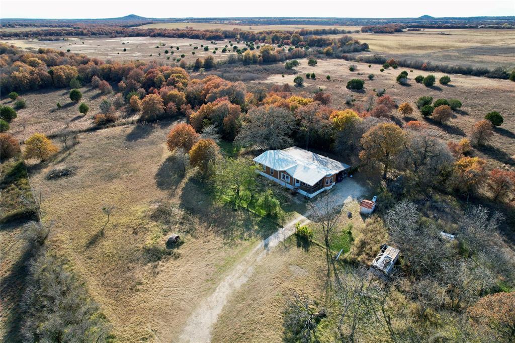 an aerial view of house with yard