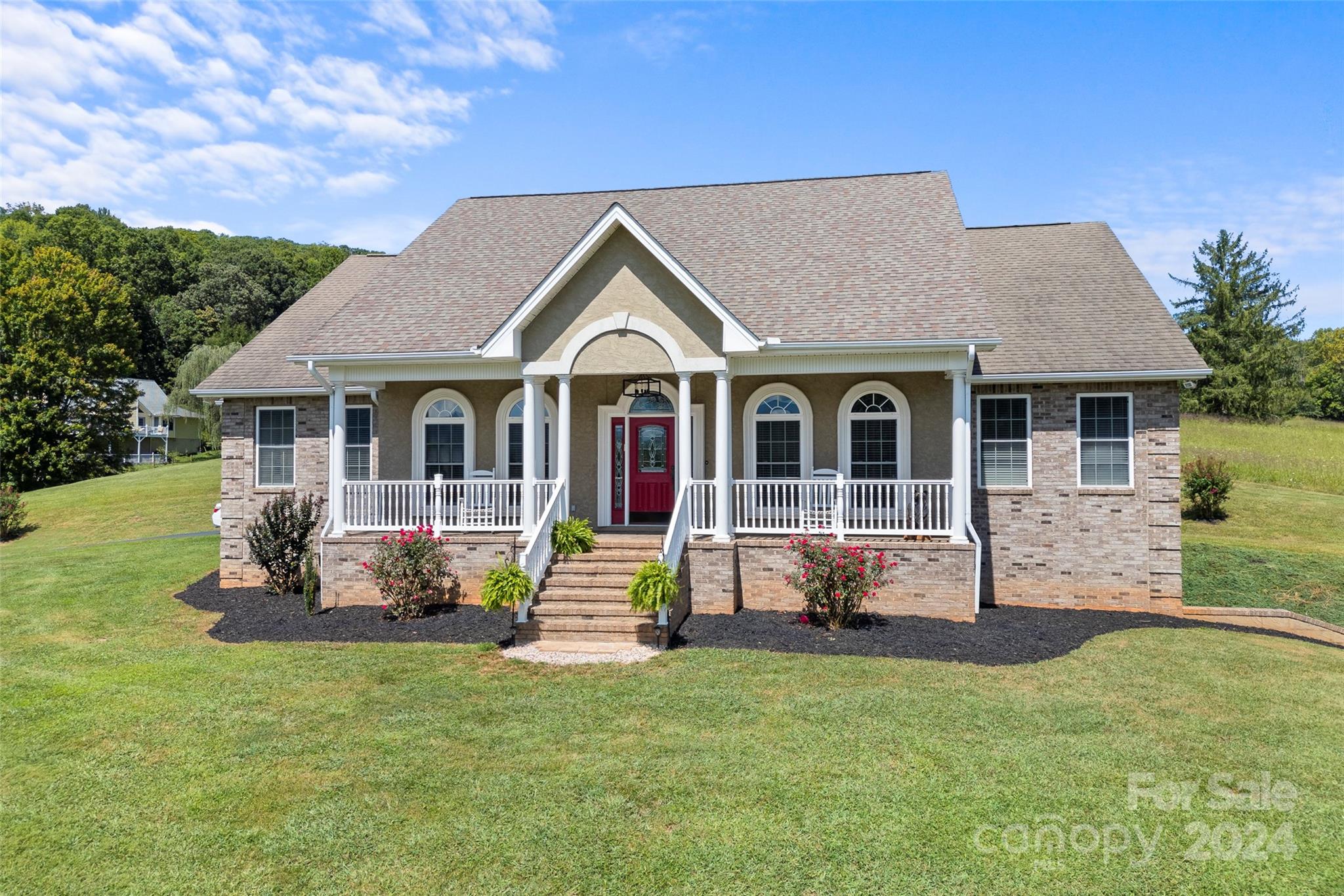 a front view of a house with a yard