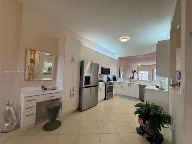 $265,000 | 7793 Granville Drive, Unit 411 | Westwood