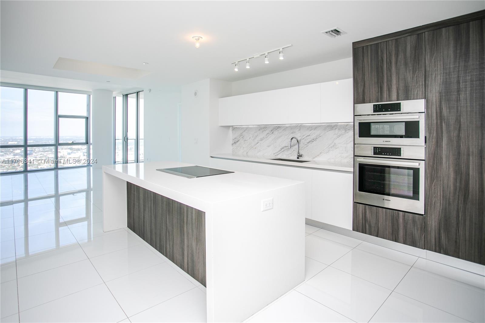 a kitchen with a stove and a refrigerator