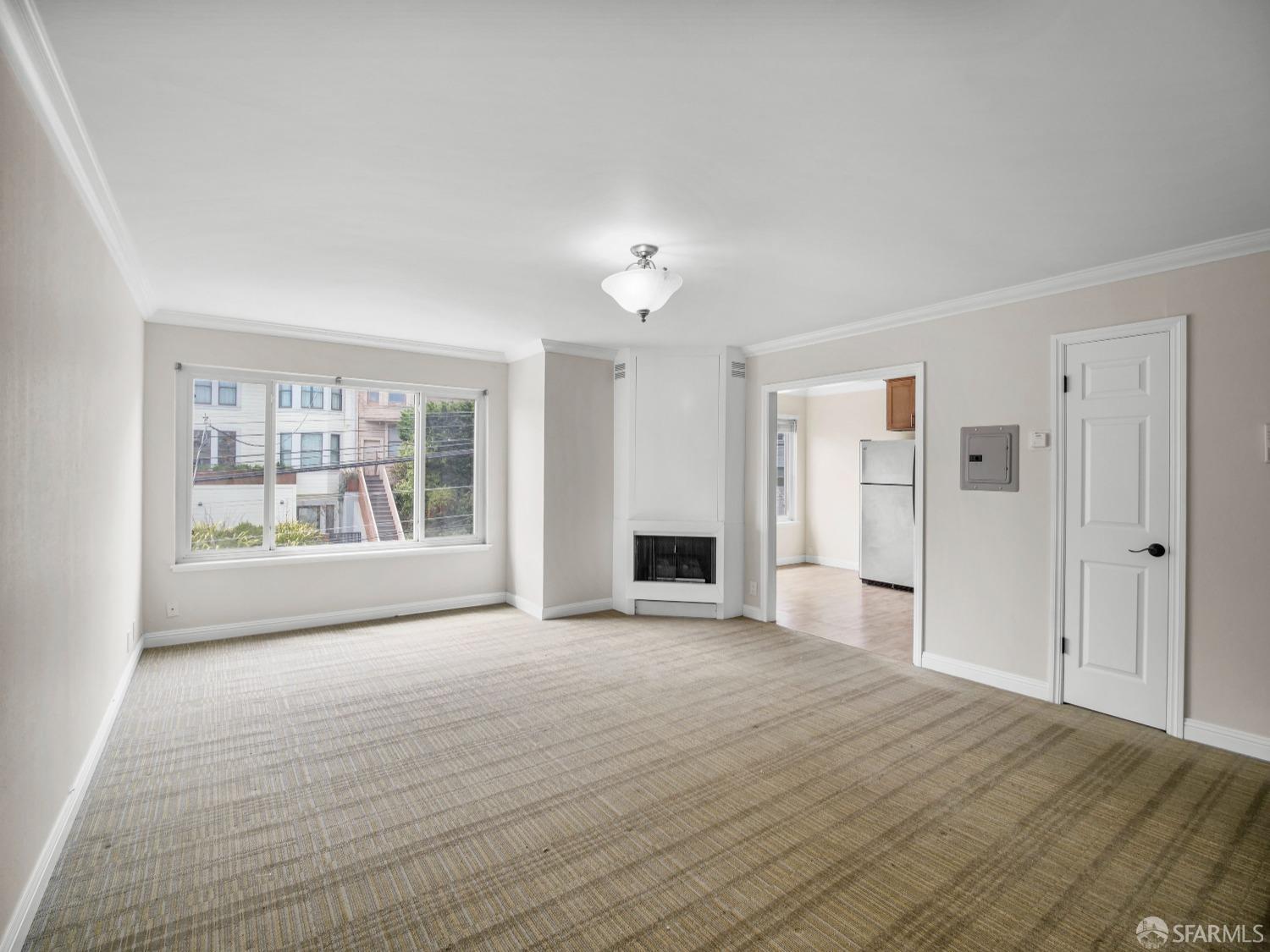 a view of an empty room with a window