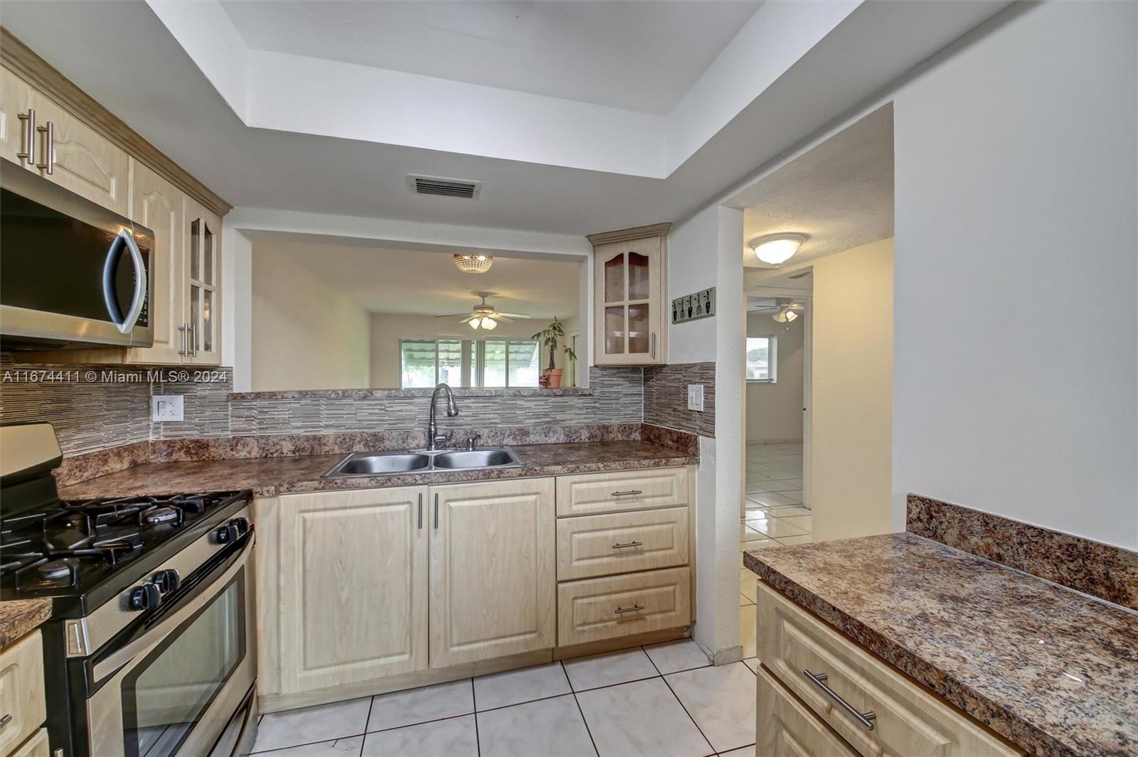 a kitchen with a stove and a sink