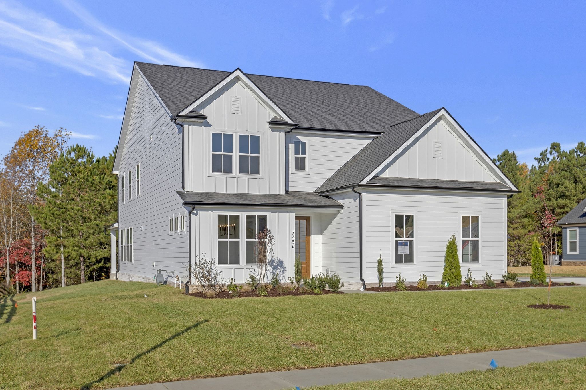 a front view of a house with a yard