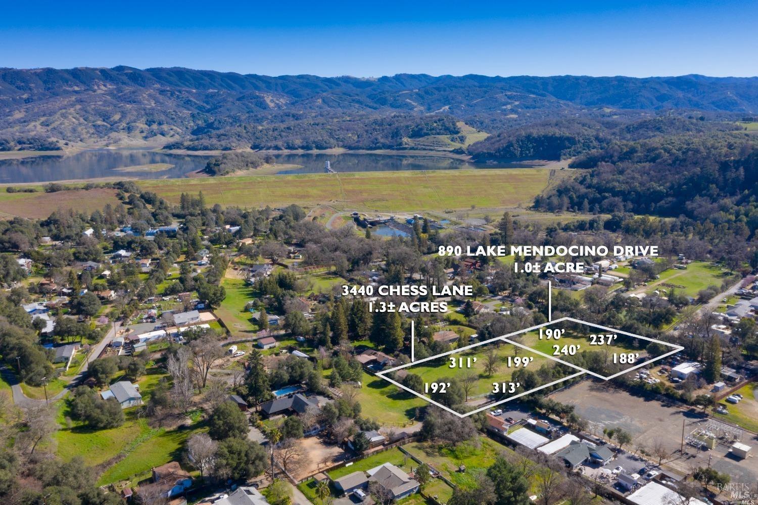 an aerial view of residential houses and lake view