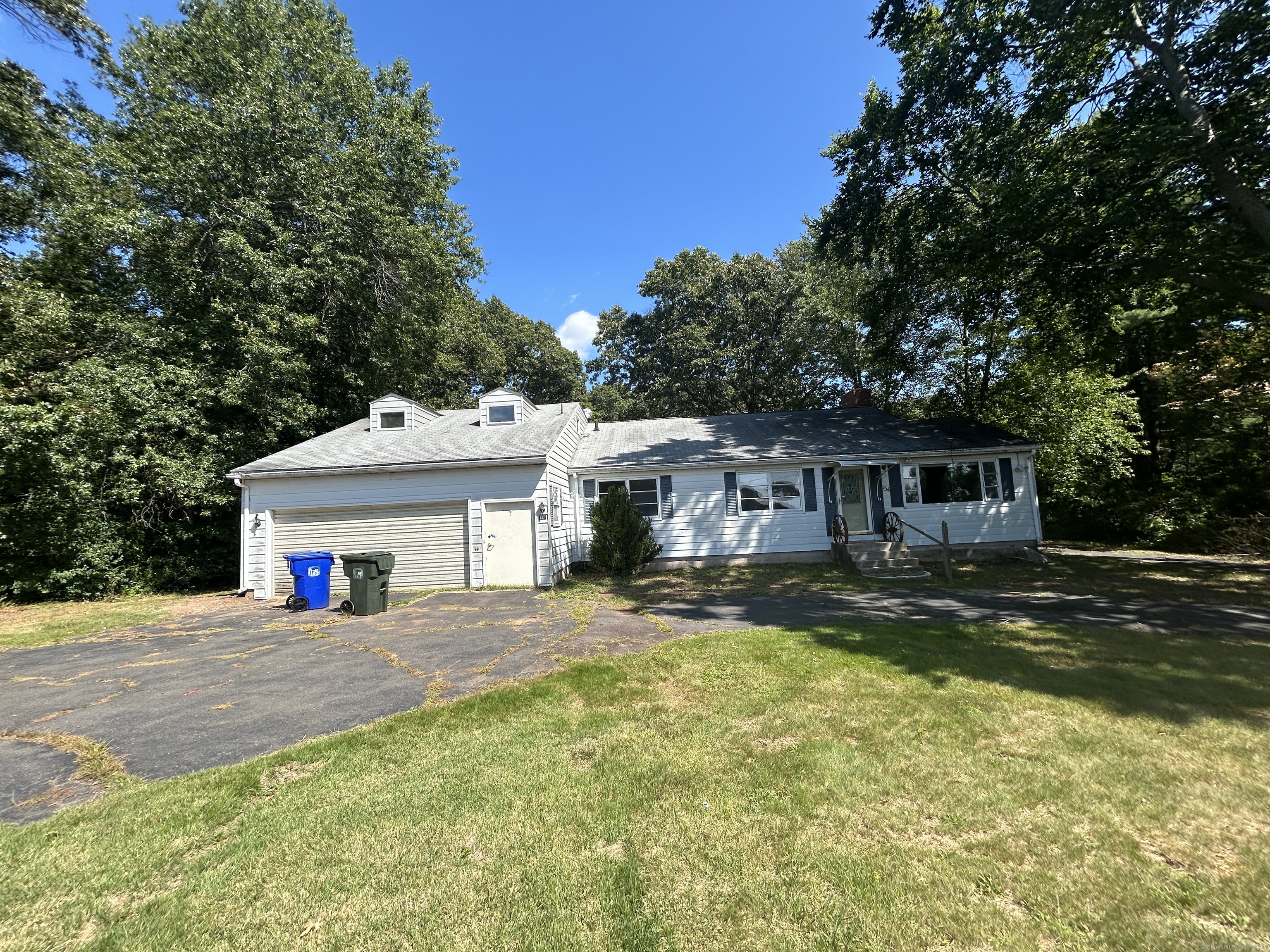 a view of a house with swimming pool next to a yard