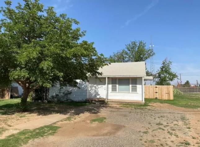 a house with a tree in front of it