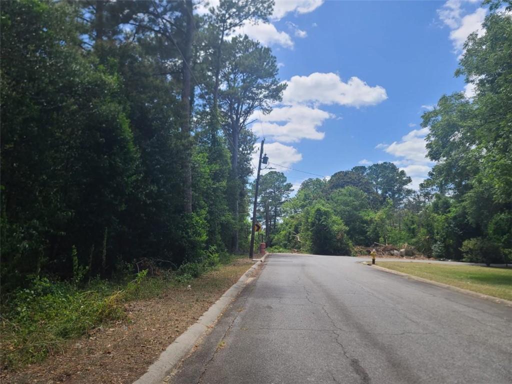 a view of a road with a yard