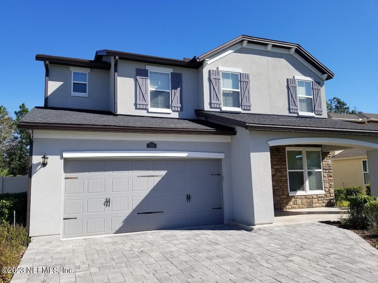 a front view of a house with a garage