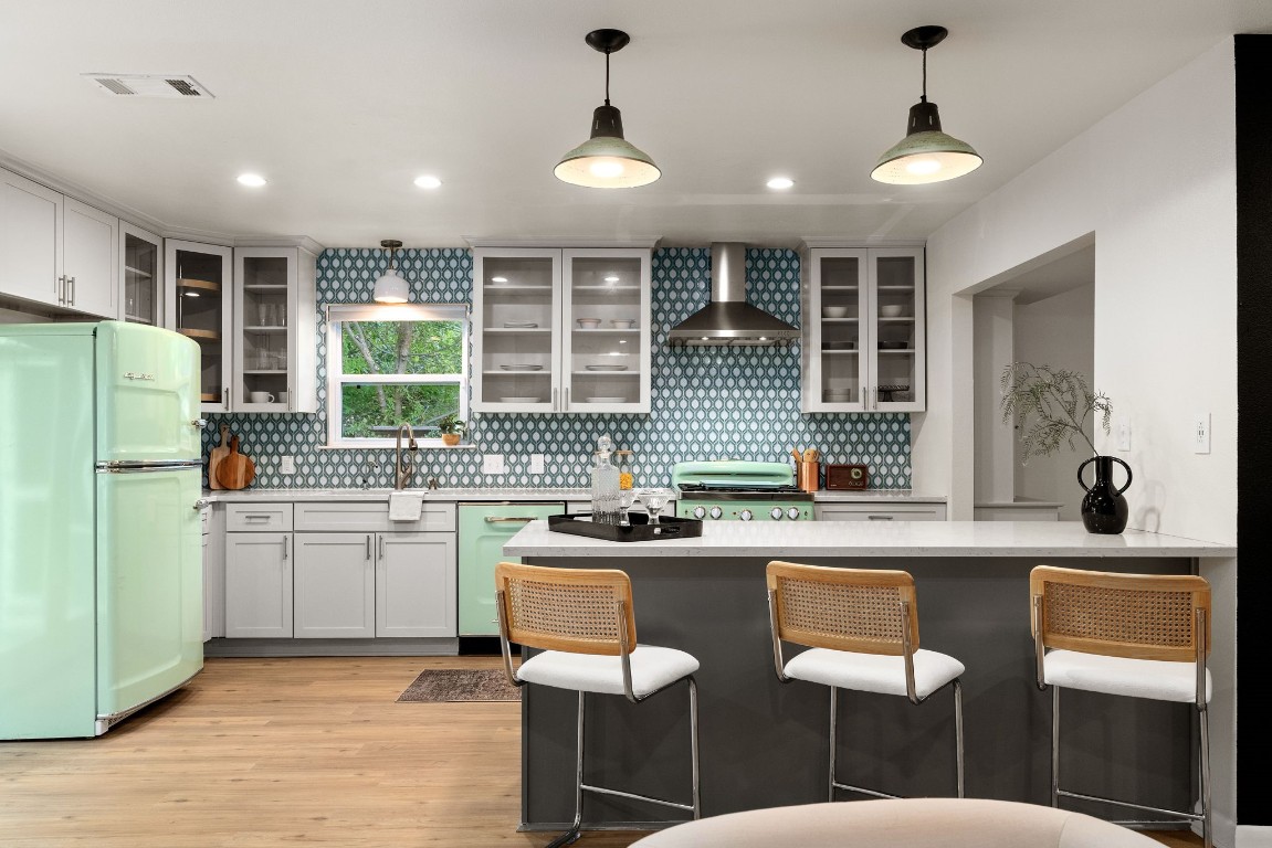 The remodeled kitchen has a retro feel and is the showstopper with its minty green appliances!