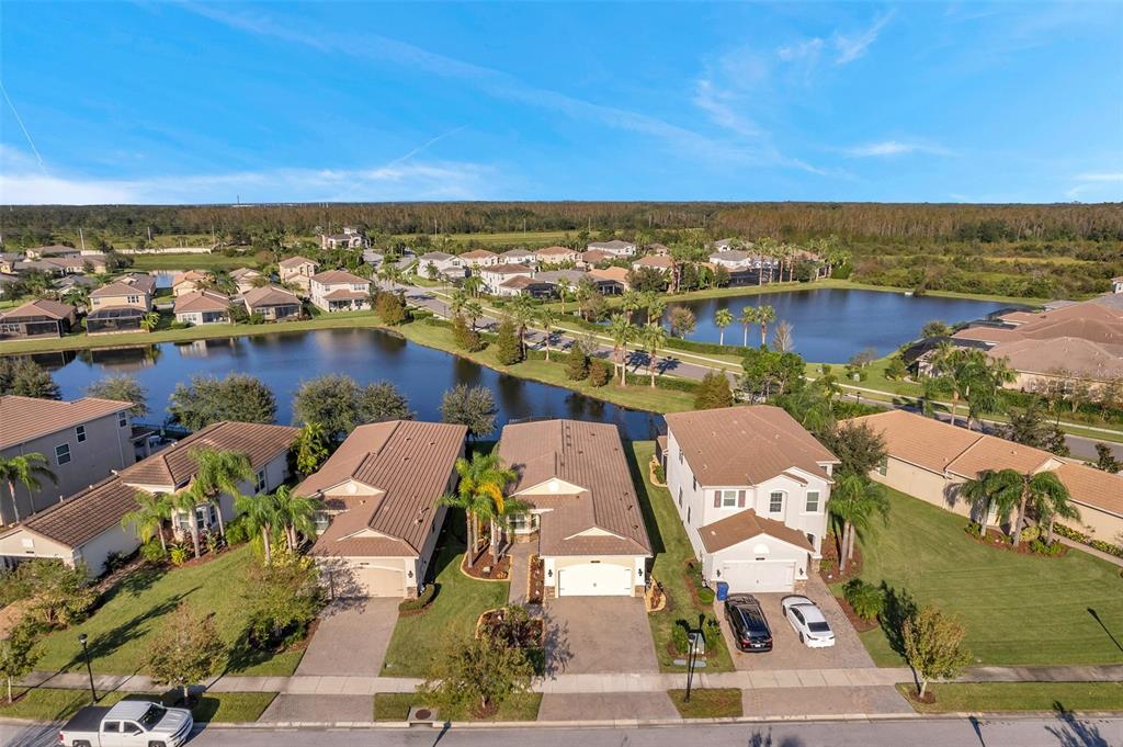 an aerial view of a house with a lake view