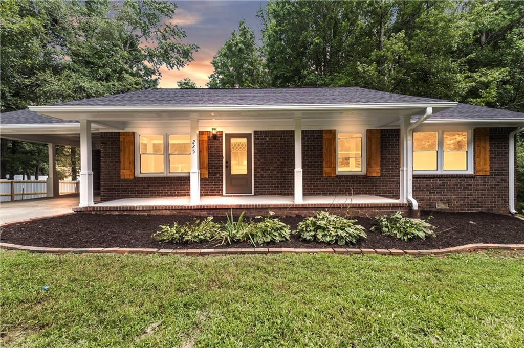 front view of a house with a yard