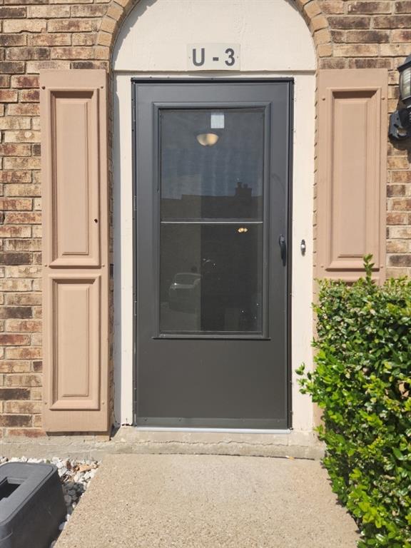 an entrance to house with yard