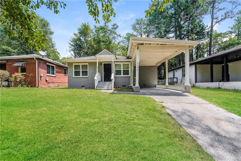 front view of a house with a yard