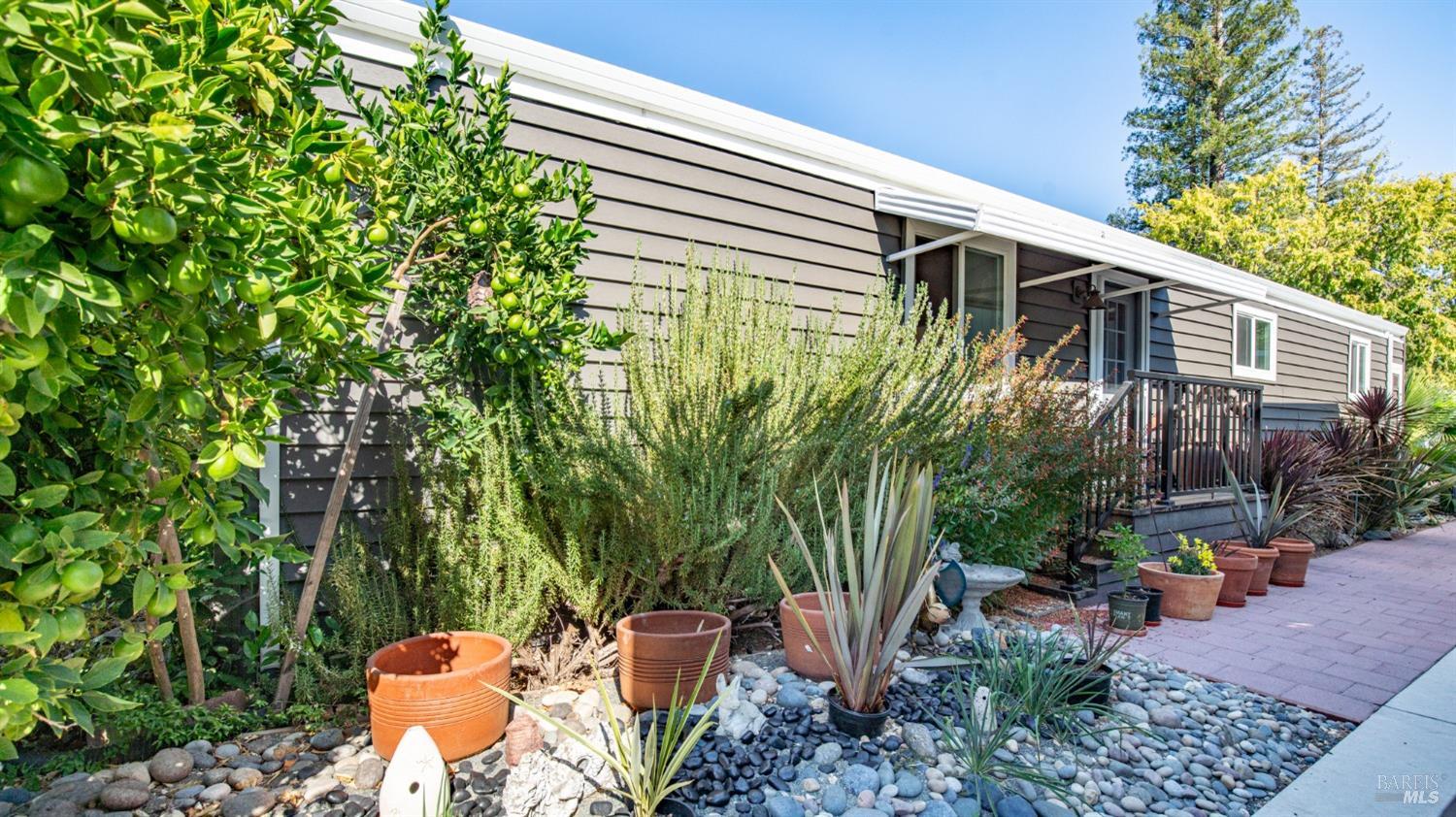 a backyard of a house with outdoor seating