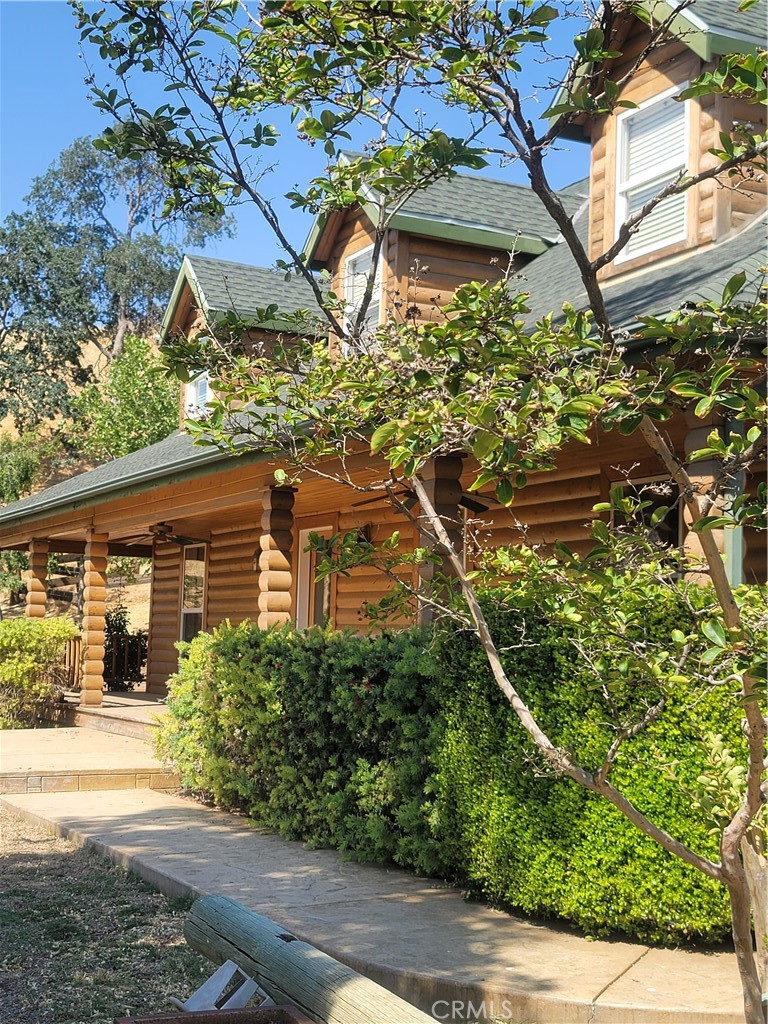 front view of a house with a tree