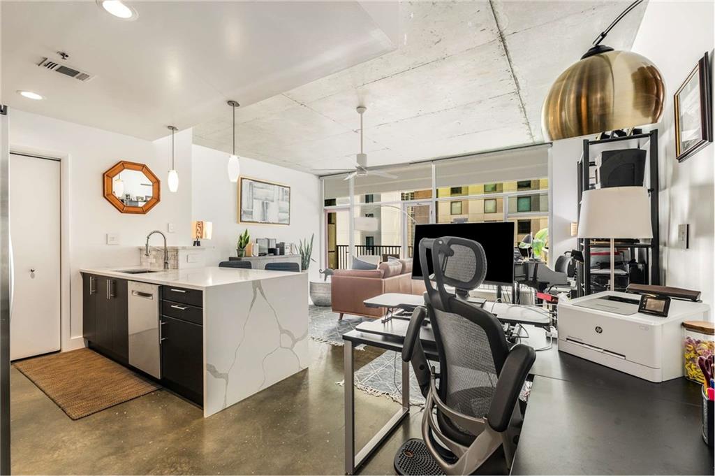 a kitchen with stainless steel appliances granite countertop a stove and a sink